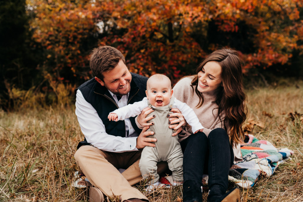 baby laughing with family 