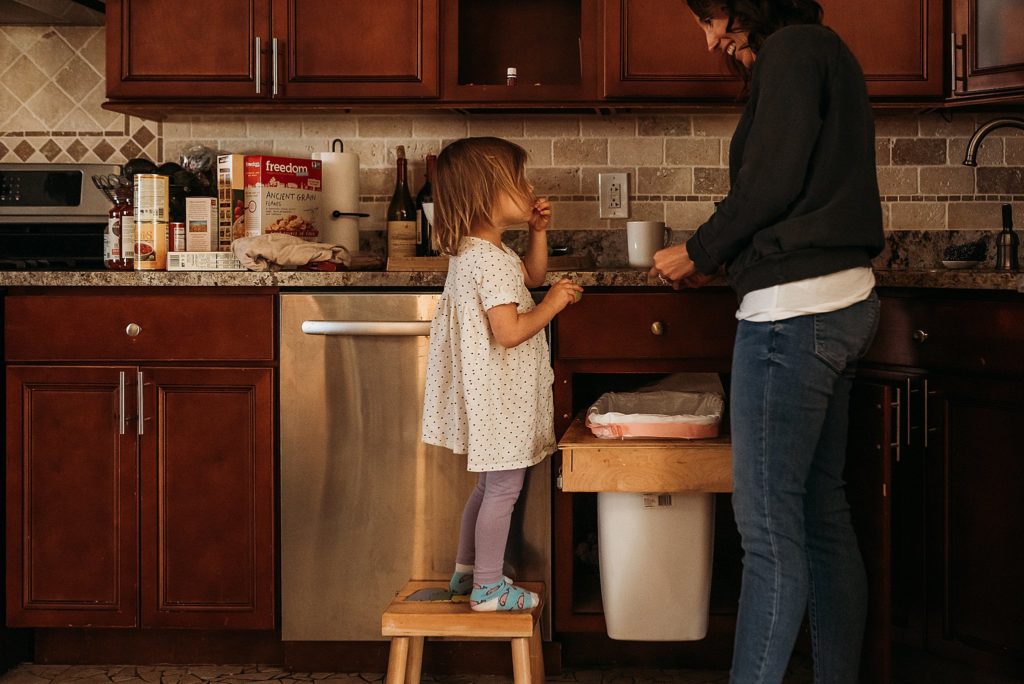 mom and daughter cleaning up after eating some family-friendly soups 
