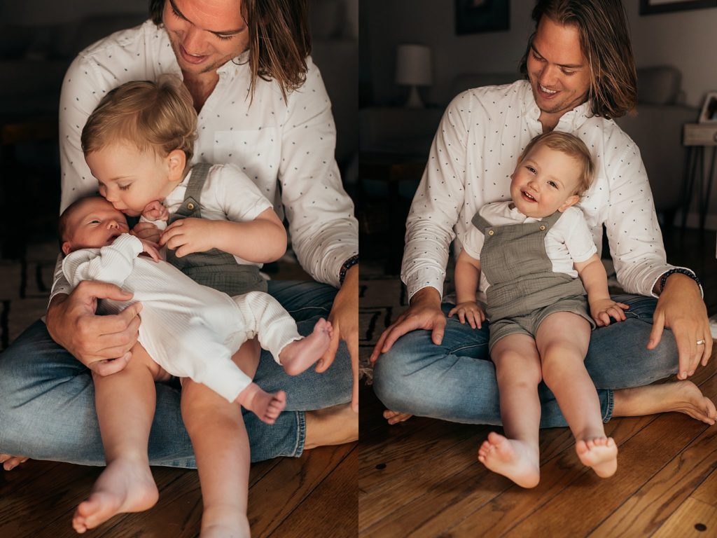 dad holding two sons during a newborn session 